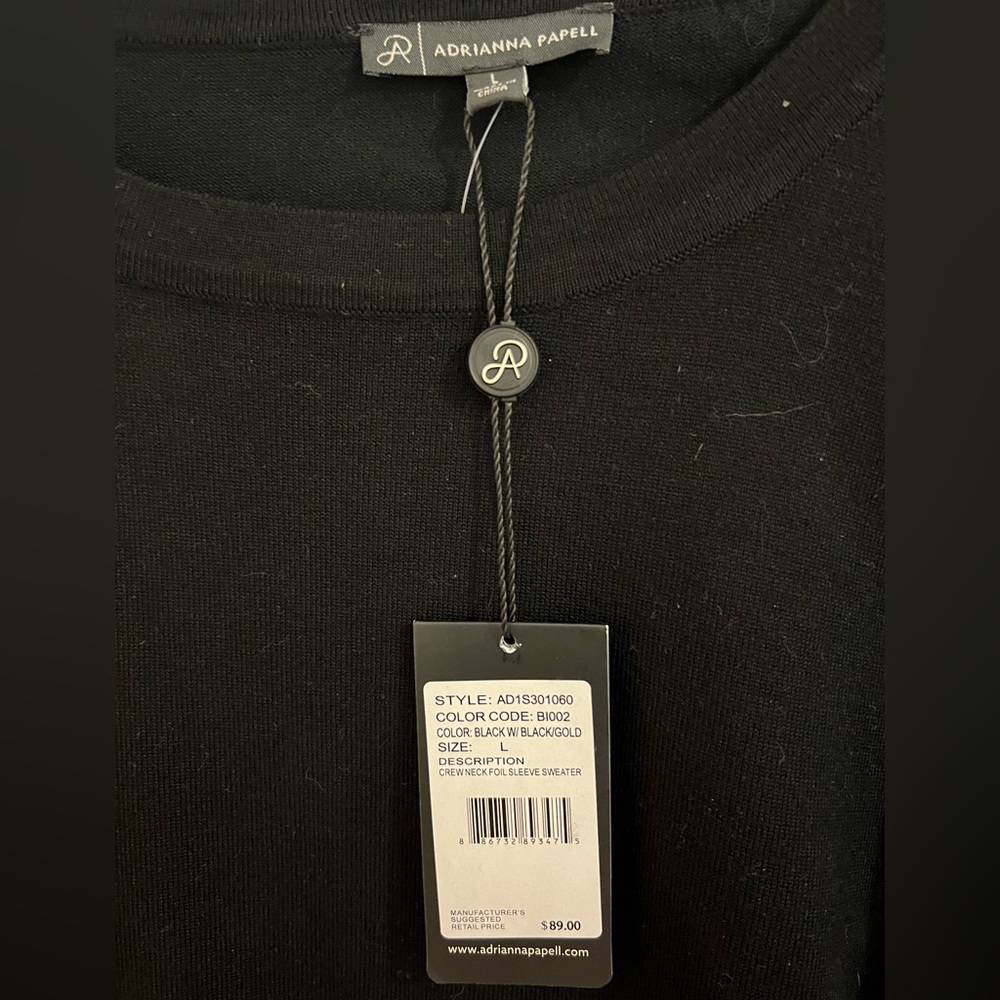Black sweater nice . Size. L  . From Adriana papel